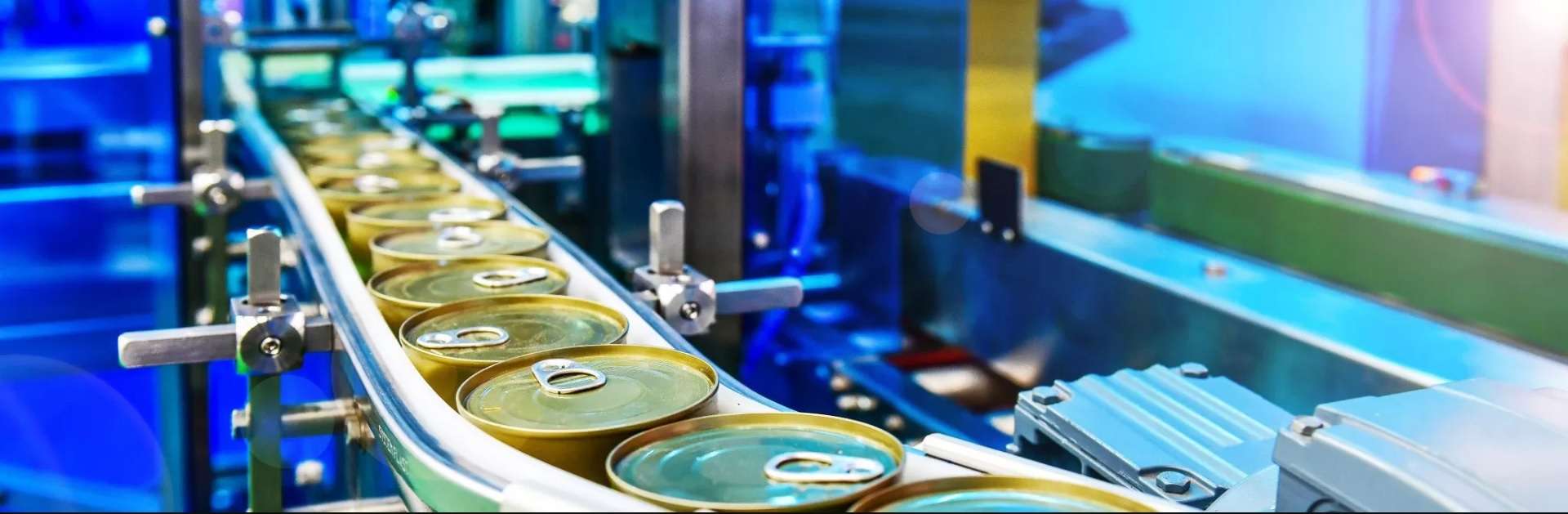 A canning machine working in the food industry.